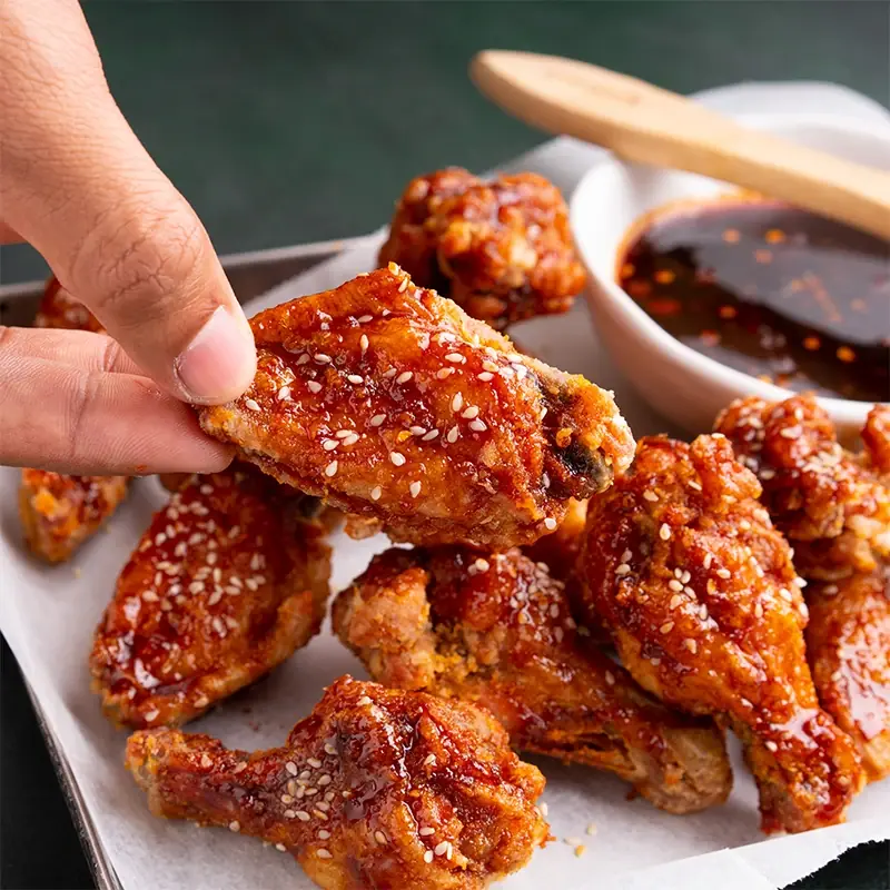 Korean fried chicken wings glazed in gochujang and sesame at Twin's Golden Cafe, Arani